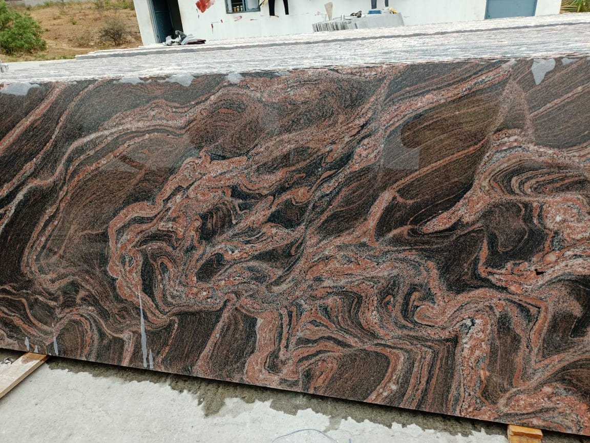 Polished slab leaning with stacked inventory behind